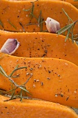 Pumpkin slices with rosemary and garlic (close-up)