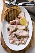 Vitello tonnato with capers, lemon and toast