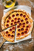 American-style pepperoni pizza, a slice cut