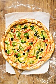 American-style vegetable pizza on server