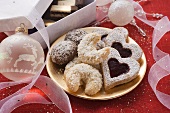 Assorted Christmas biscuits on plate and in box