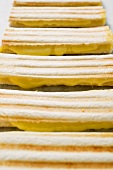 Several toasted cheese sandwiches in a row (detail)