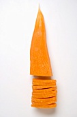Peeled carrot, partly sliced