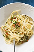 Spaghetti with chillies and herbs (overhead view)