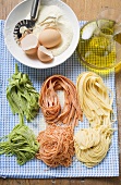 Various types of home-made pasta with ingredients