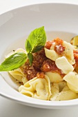 Tortellini with tomato sauce, butter and basil