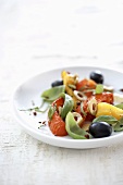 Pepper salad with olives and basil