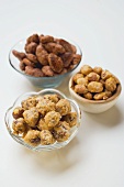 Assorted nuts to nibble in bowls
