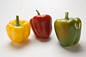 Three peppers (yellow, red, green)