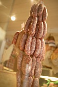Sausages hanging up in a shop