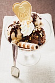 Chocolate nut sundae with cream and wafers