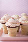 Strawberry ice cream cones on pink tray