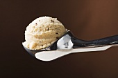 Scoop of ice cream in ice cream scoop