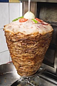 Döner kebab on spit in the kitchen of a snack bar