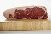 Sirloin steak on chopping board