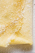 Crêpe with icing sugar (overhead view)