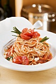 Spaghetti with tomatoes and rosemary