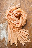 Home-made orange ribbon pasta