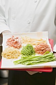 Chef presenting various types of home-made pasta