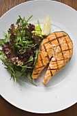 Grilled salmon cutlet with salad
