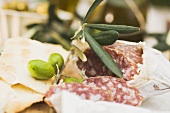 Salami, green olives and crackers