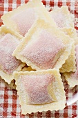 Home-made ravioli on glass plate