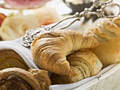 Croissant and sweet pastries in bread basket
