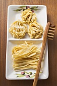 Home-made ribbon pasta with spaghetti server