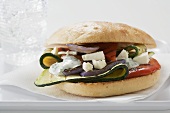 Toasted roll filled with grilled vegetables & sheep's cheese