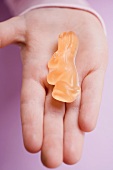 Child's hand holding jelly Easter Bunny