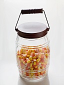 Candy corn (Halloween sweets, USA) in storage jar