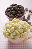 White and dark chocolate chips in pink paper cases
