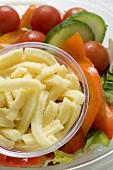 Salad with grated cheese to take away (close-up)