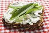 Quark and ramsons (wild garlic) on wholemeal bread