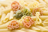 Coloured animal-shaped pasta and penne