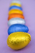 Chocolate eggs wrapped in coloured foil