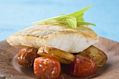 Fish fillet with fried potatoes and cherry tomatoes