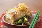 Fish fillet with spring onions and lime