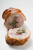 Rolled pork roast with crackling and herb stuffing