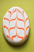 Easter biscuit (Easter egg) on yellow linen
