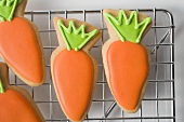 Easter biscuits (carrots) on cake rack