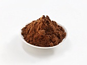 Cocoa powder in white bowl