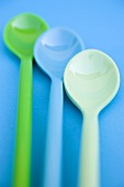 Three plastic spoons