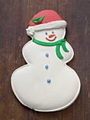 Snowman biscuit on wooden background