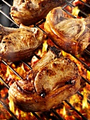 Pork chops on barbecue rack