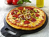 Pepperoni pizza with chilli rings and onions