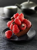 Small chocolate cake with raspberries to serve with tea