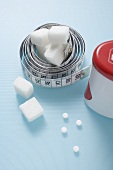 Tape measure, sweetener tablets and sugar cubes