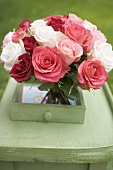 Bouquet of roses on a table in the open air