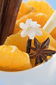 Orange slices with star anise, lemon grass & sugared flower